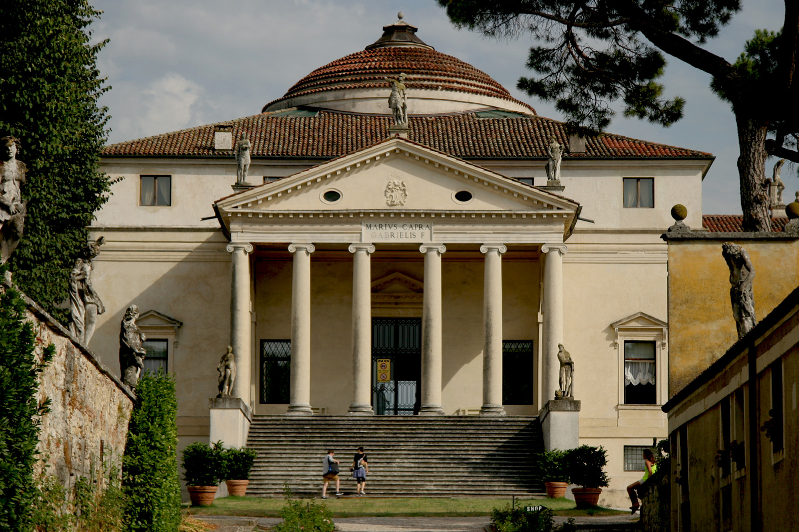 Villa Rotonda outside Vicenza, Italy, a symmetrical square block topped by a central dome, with a Roman temple-front portico of columns and a pediment on the visible facade