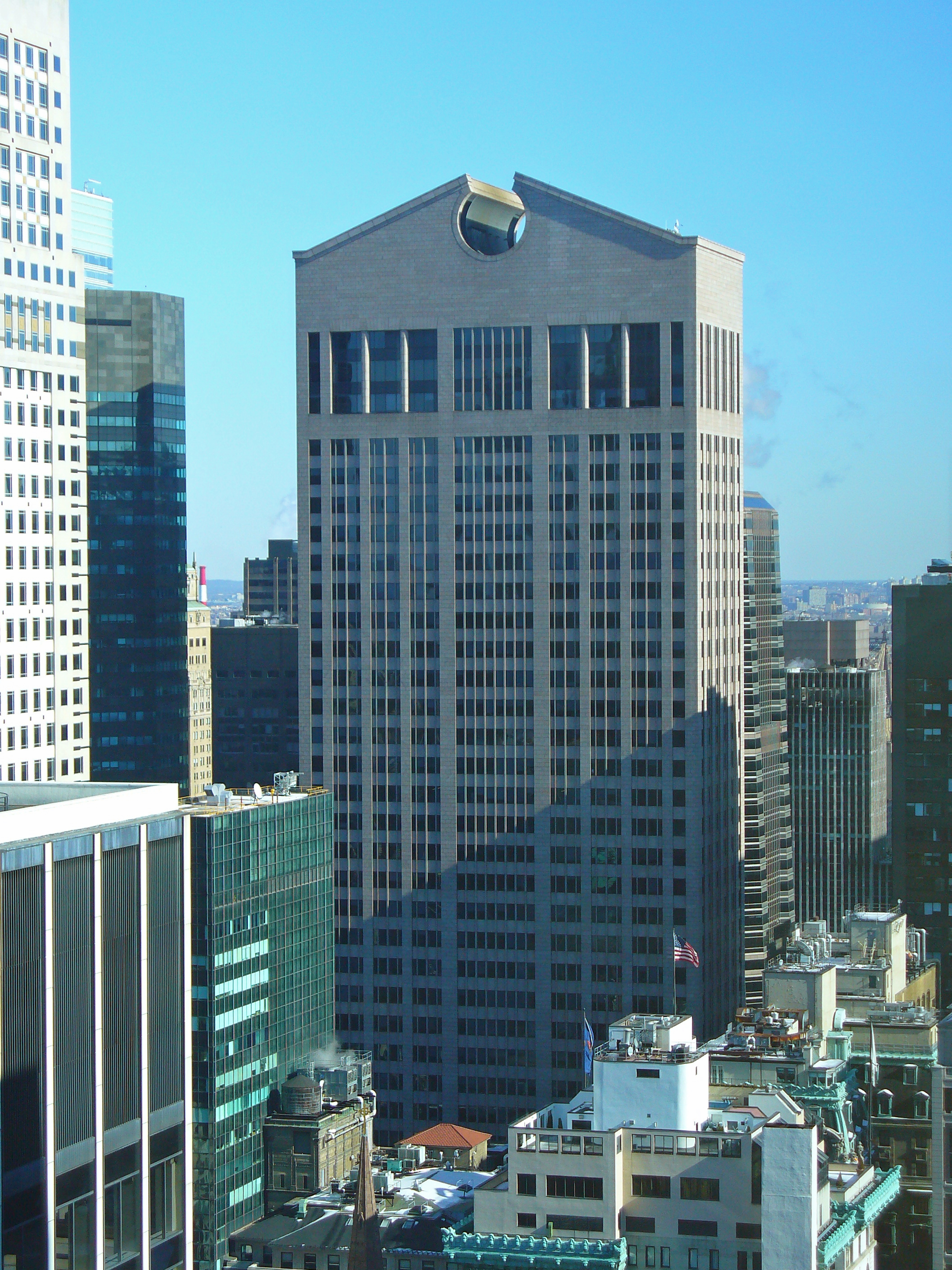 The AT&T Building at 550 Madison Avenue in Manhattan, its granite tower topped by a giant broken pediment with a circular opening, the roofline critics nicknamed Chippendale